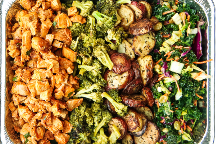 Bolay Fresh Bold Kitchen catering/family meal pan containing lemon chicken, broccoli, roasted potatoes, and kale salad